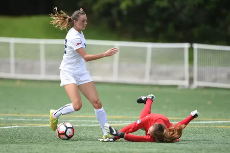 <center><i>MacKenzie Cowley avoids a diving Cleveland State goalkeeper before scoring on Sunday.</i></center>