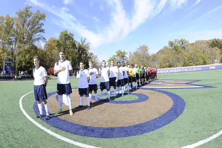 Men's soccer lines up for the national anthem