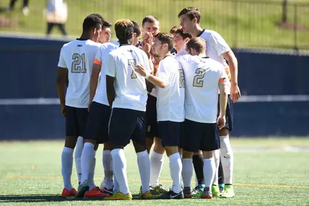 Men's soccer huddle