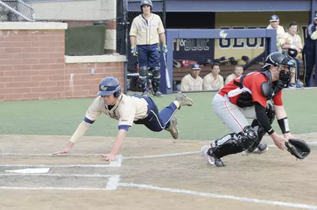 Baseball diving head first into home