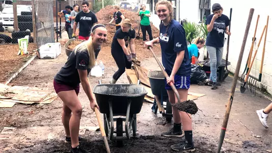 Riley Tejcek (left) and Faith Weber spent a week of winter break volunteering in Florida.