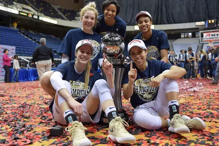 GW seniors Taylor Campbell, Brianna Cummings, Camila Tapias and Kelli Prange celebrate the A-10 Championship with Strength & Conditioning Coach Brandi Walker