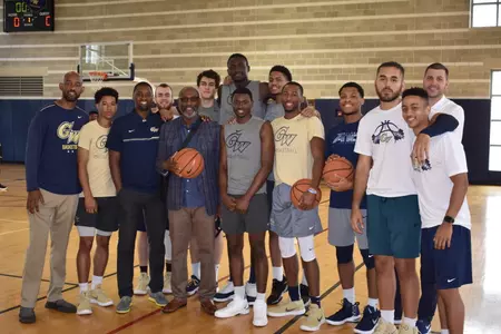 Troy Webster visited with the current Colonials before a summer workout in June.