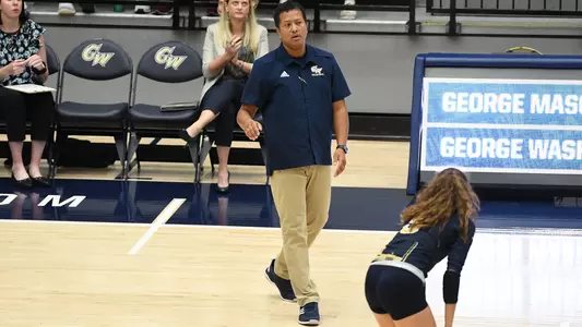 Volleyball Associate Head Coach Nicki Holmes delivers instructions