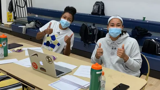 Jasmine Whitney and Essence Brown participate in the GW Athletics Hour of Action