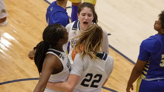 Aurea Gingras celebrates with her teammates after a made basket
