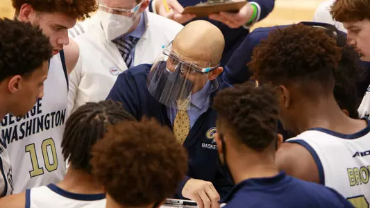 Head Coach Jamion Christian talks to his team.