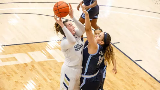 Ali Brigham shoots over Old Dominion.