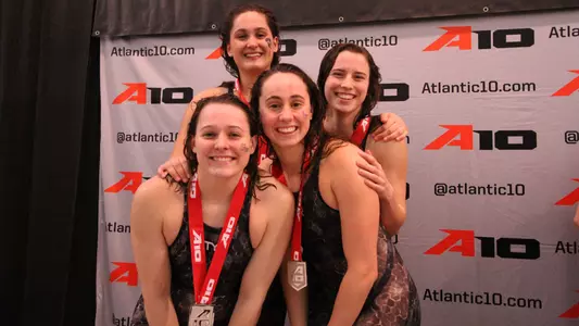 Meghan Burton, Grace Olivardia, Becca Brown and Rebecca Smolcic pose with their medals