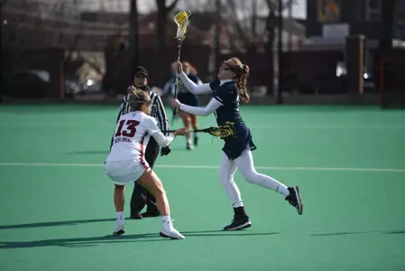 Katie Quinn passes the ball.