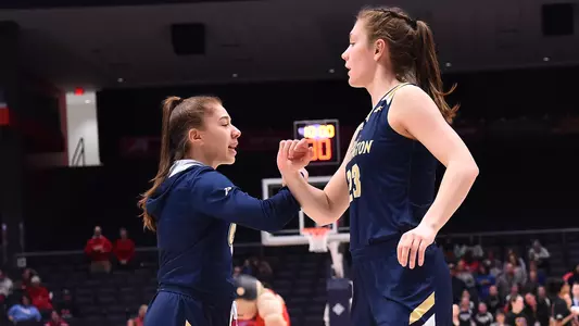 Faith Blethen and Lexus Levy fist bump