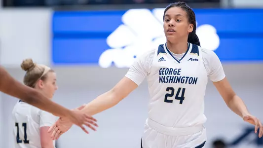 Kayla Mokwuah exchanges high fives.