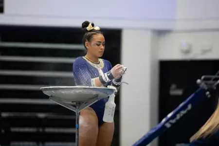 Rachel Kaplan putting on chalk for competition
