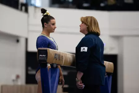 Cydeny Crasa and Coach Margie Forst-Cunningham at beam
