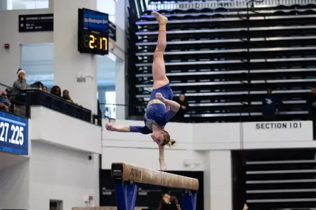 Olivia Raymond competes on beam.