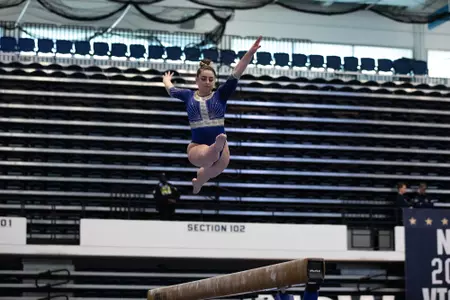 Hannah Cohen competes on balance beam.