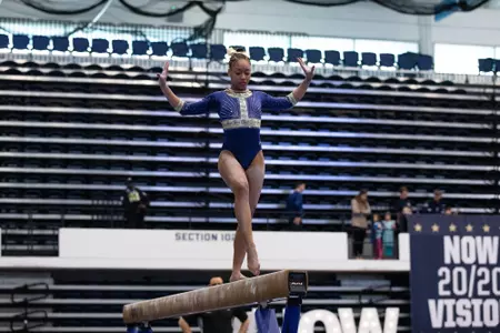 Deja Chambliss competes on balance beam.