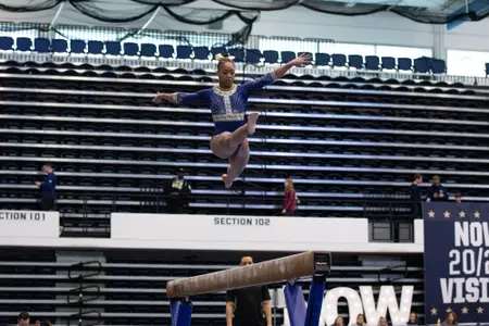 Deja Chambliss competes on balance beam.