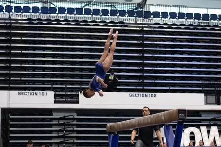 Deja Chambliss competes on balance beam.