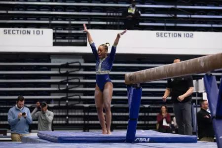 Deja Chambliss celebrating her balance beam routine