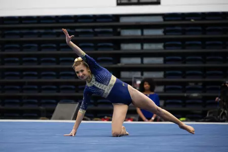 Olivia Zona competing on floor.