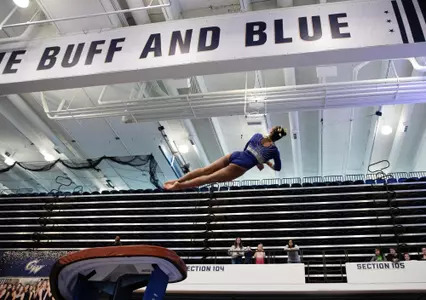 Deja Chambliss competes on vault.