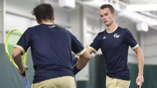 Jakub Behun high-fives his teammate.