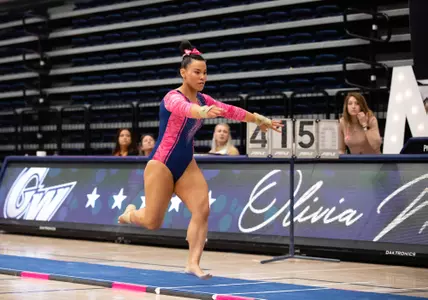 Olivia Norman competes on vault.