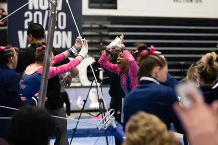 Deja Chambliss celebrates her bar routine.