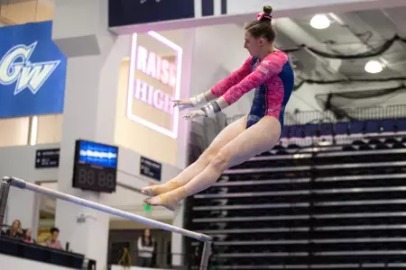 Anna Warhol competes on bars.
