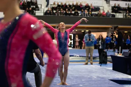 Zona competes on balance beam.