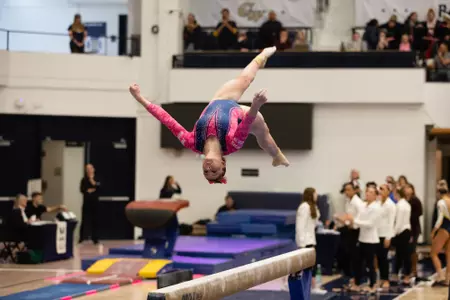 Olivia Raymond competes on beam.