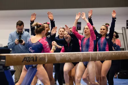 Simone Banen celebrates with team.
