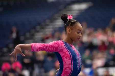 Deja Chambliss competes on balance beam.