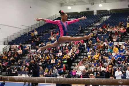 Deja Chambliss competes on balance beam.