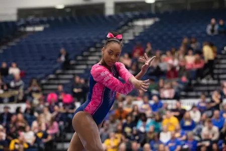 Deja Chambliss competes on floor.