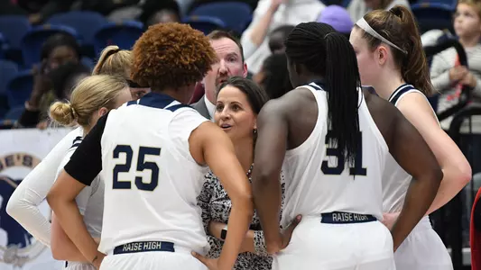 Head coach Jen Rizzotti speaks to her team during a timeout