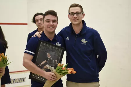 Jamie Oakley and Head Coach Anderson Good posing during senior game celebration.