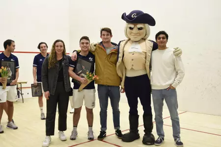 Jamie Oakley and family posing with George at senior game.