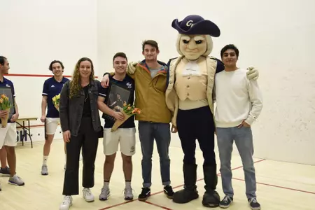 Jamie Oakley and family posing with George at senior game.