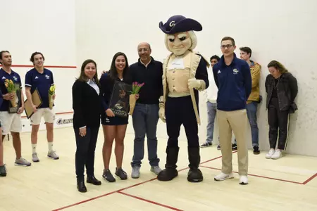 Engy Elmandouh and family during senior game with Head Coach Anderson and George.