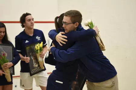 Emma Tyron and Head Coach Anderson Good during senior game celebration