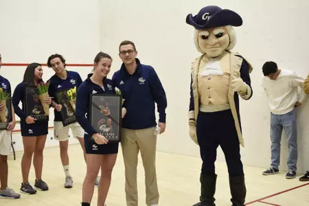 Emma Tyron, Head Coach Anderson Good, and George posing during senior game celebration.