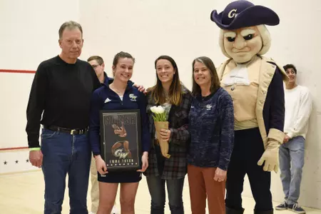 Emma Tyron and family all smiles with George during senior game celebration.