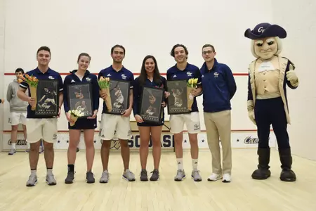 Jamie Oakley, Emma Tyron, Juan Sebastian Laguna, Engy Elmandouh, Geordie Laird, and Head Coach Anderson Good pose with George during senior game celebration
