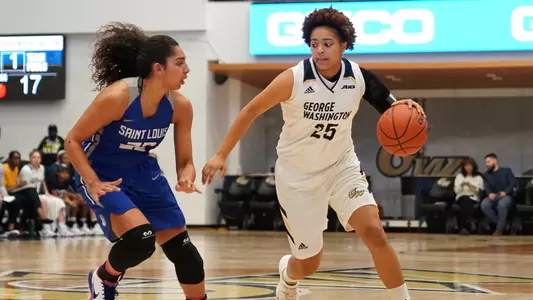 Ariel Stephenson dribbles against a Saint Louis defender.