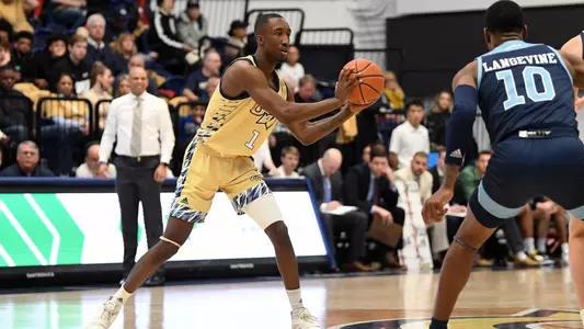 Shawn Walker Jr. makes a pass against Rhode Island