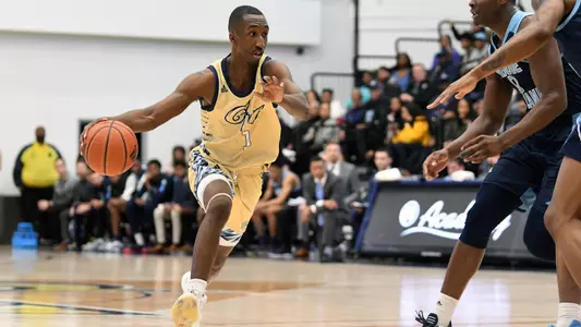 Shawn Walker Jr. drives the lane against URI