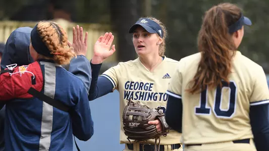 Faith Weber high-fives a teammate vs. Winthrop.