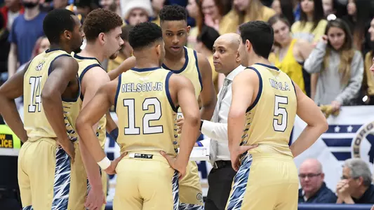 Picture: Christian in huddle with team